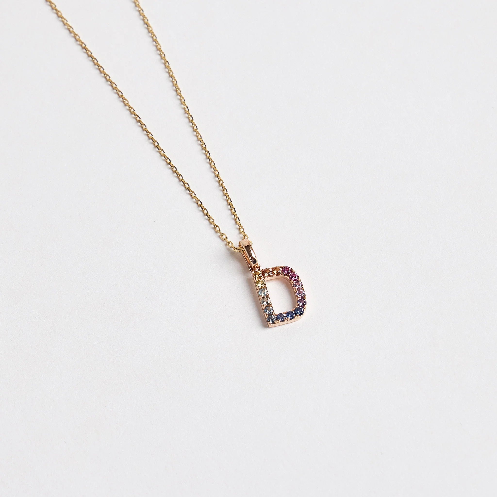 multi colored sapphire letter pendant